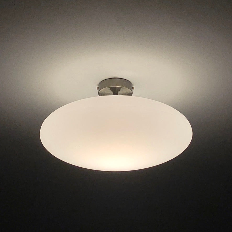 Flush ceiling light fitting