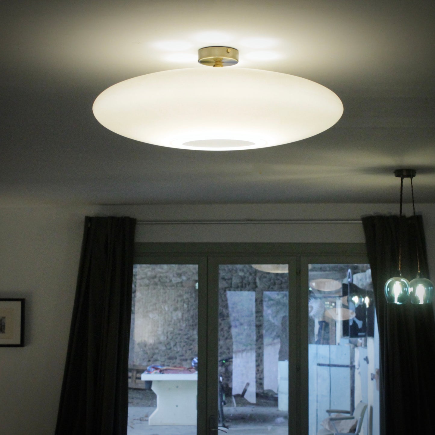 Flush ceiling light fitting